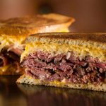 Langer’s #44 hot pastrami Reuben grilled on double-baked rye