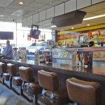 deli counter bathed in warn light from the window