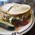 delicious pastrami sandwich on rye bread with cole slaw